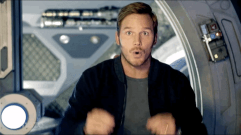 Chris Pratt holding his hands to his head and mimicing an explosion.