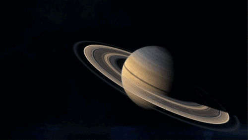 Zoom in from looking at Saturn to Saturn's rings